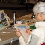 Sheila Churchill works on her painting